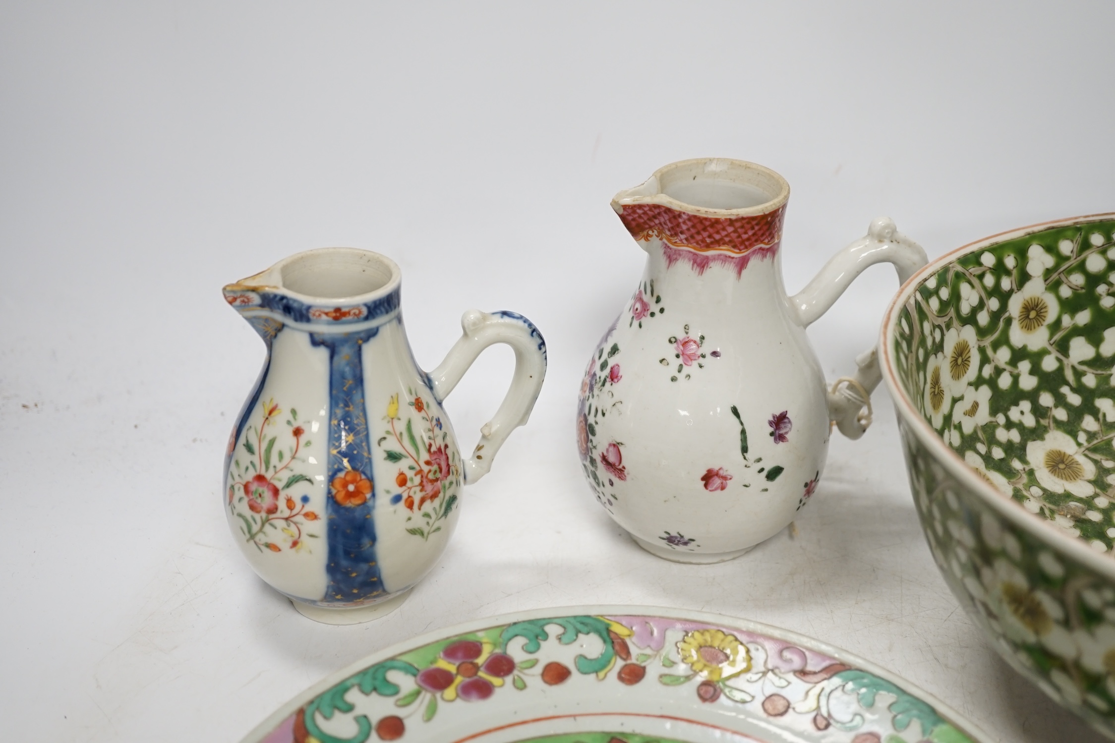 Two 18th century Chinese export porcelain jugs, a pair of famille rose plates made for the Thai market and a Japanese floral bowl, 24cm. Condition - varies